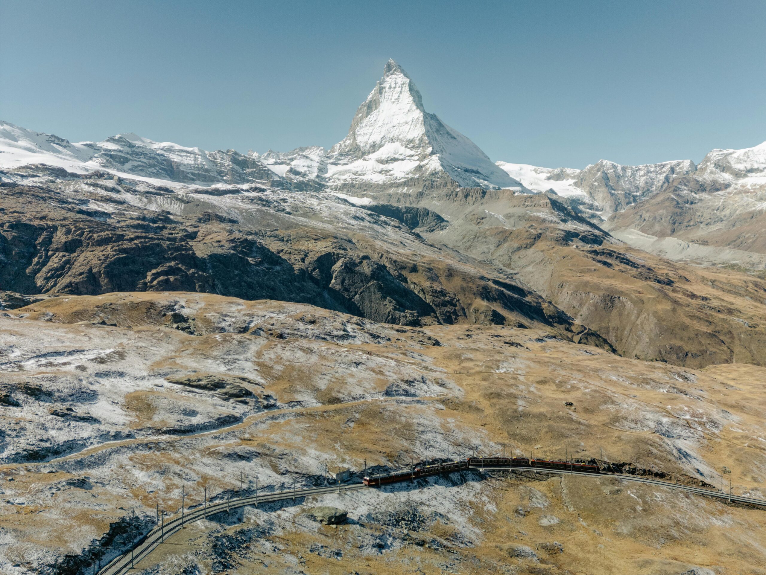 A train passing through majestic, snow-capped Alps. Starting from ₹55,000